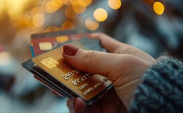 credit cards in woman's hand